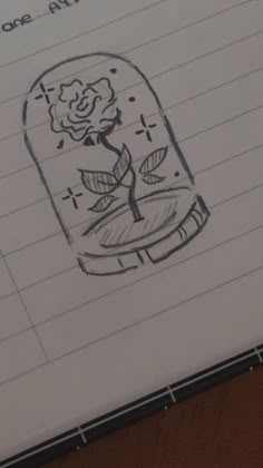 a drawing of a rose in a jar with writing on it