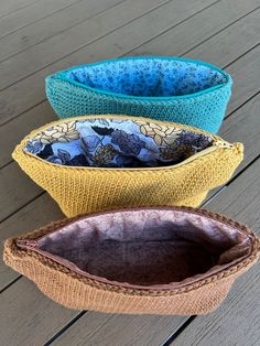 three bowls sitting on top of a wooden table