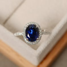 Halo engagement ring sapphire ring oval cut blue gemstone | Etsy Oval Sapphire Promise Ring, Oval Lab-created Sapphire Wedding Jewelry, Oval Cubic Zirconia Sapphire Ring Gift, Wedding Jewelry Oval Lab-created Sapphire, Silver Lab-created Sapphire Ring With Halo Design, Oval Lab-created Sapphire Jewelry For Wedding, Wedding Oval Lab-created Sapphire Jewelry, Blue Oval Birthstone Ring With Halo Setting, Classic Lab-created Sapphire Ring With Halo Design