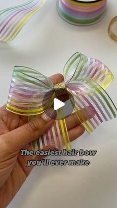 someone is holding a ribbon with the words, the fastest hair bow you'll ever make