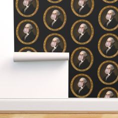 a wallpaper with an image of george washington in gold and black on it's side