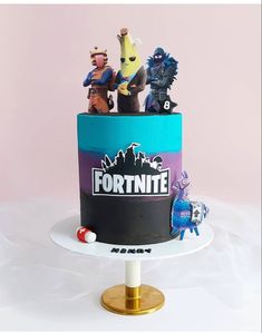 a cake decorated with figurines on top of it