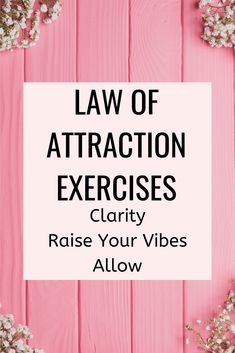 the words law of attraction exercises clarify raise your vibes allow on pink wood background