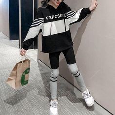 2-piece Color-block Hoodie & Pants for Girl - PrettyKid Trendy Black Long Sleeve Sets, Trendy Black Sets For Winter, Trendy Black Winter Sets, Black Stretch Sets For Winter, Casual Patchwork Sets For Winter, Black Hooded Sets For Fall, Black Hooded Fall Sets, Black Hooded Cotton Set, Black Letter Print Sets For Fall