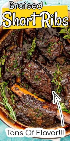 a pan filled with short ribs covered in gravy and garnished with herbs