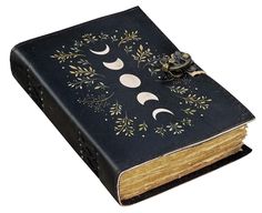 an old book with the moon and crescents on it's cover is shown