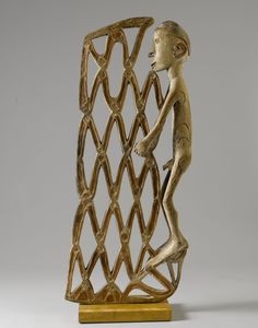 a sculpture of a boy climbing on a trellis