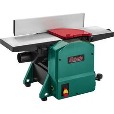 a green and red table sawing machine on a white background