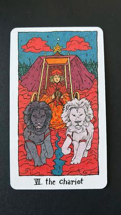 a tarot card with two lions on it