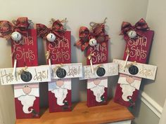 three christmas stockings with santa signs on them