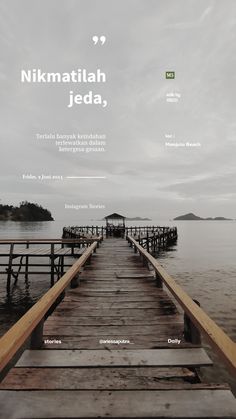 a wooden dock sitting on top of a body of water next to a shore covered in clouds