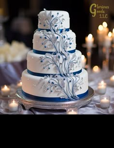 a wedding cake with blue and white decorations