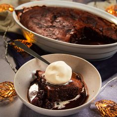 two bowls filled with brownie and ice cream on top of a table next to each other