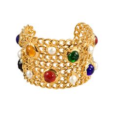 A beautiful gold plated cuff, fashioned in signature "Chanel Chain". The cuff features multi-colored bezel set glass stones and pearls and is stamped and marked Chanel. Chanel Cuff, Vintage Chanel Jewelry, Chanel Brooch, Chanel Chain, Expensive Jewelry Luxury, Y2k Jewelry, Fall 24, Gold Bracelet Cuff, Expensive Jewelry