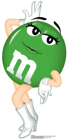 a woman holding a green ball with the letter m on it