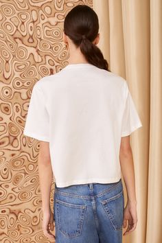 Fusing elegance and comfort, our T-shirt style Aris Top is made from white cotton jersey with a burst of raw-edge ruffles that twist and dance across the front. The cotton is organic and sustainably-sourced, part of our ongoing efforts to minimize our impact on the Earth. Composition: 100% Cotton Pair with our April Jean to complete the look. Nyc Boutiques, Summer Clothing, Knit Sweatshirt, Signature Print, Event Dresses, Ulla Johnson, Swimwear Accessories, Raw Edge, Summer 2024