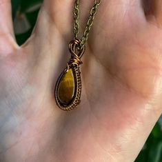 This item is made to order, please allow 2-14 days for order fulfillment. This mini pendant is made with a tigers eye crystal and brown copper filled wire. Measurements: 1 in x .5 in Comes with a 16 in chain. Please keep in mind that this item is handmade, so every pendant will not look exactly the same. Tigers eye is known to release fear and anixety and help harmony and balance. Tigers Eye Pendant, Copper Aesthetic, Tigers Eye Jewelry, Sign Aesthetic, Tigers Eye Crystal, Release Fear, Brown Copper, Tiger Eye Gemstone, Tiger Eye Jewelry