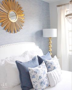 the instagram page is displayed with an image of a white bed and blue pillows