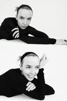 a woman laying on the ground with her hands behind her head and smiling at the camera