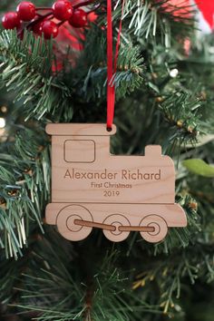 a wooden ornament hanging from a christmas tree