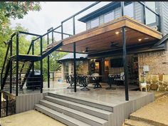 an outdoor patio with stairs leading up to it