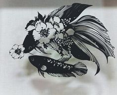 two fish with flowers in their beaks on a white sheet that has been drawn