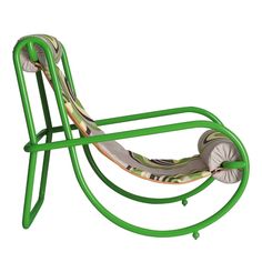 a green rocking chair with an intricate design on the back and seat, designed by person