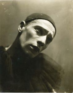 an old black and white photo of a man with a turban on his head