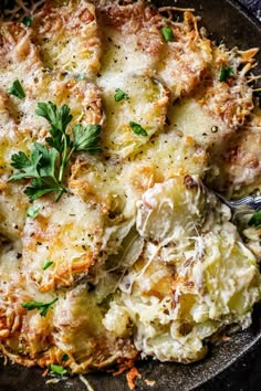 a skillet filled with pasta and parmesan cheese