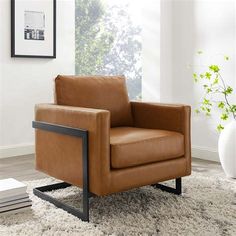 a brown leather chair sitting on top of a white rug