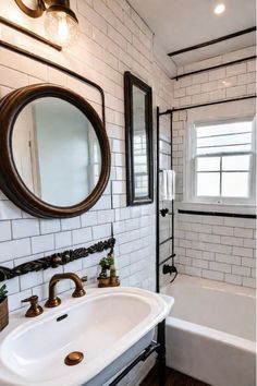 a bathroom with a sink, mirror and bathtub in the corner is white tile