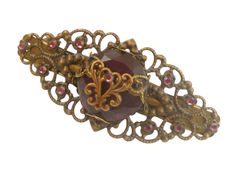 This noble unique hair clip is worked in antique style and a beautiful accessory for the bride or for other festive occasions. The hair ornament is made of bronze colored metal. In the middle is a faceted purple glass gem wrapped with a metal ornament and decorated with another brass flourish ornament. The hair clip is also decorated with branded rhinestones in purple. The hair clip has the dimensions 3.5 L x 8 W cm. Rhinestone Wedding Hair Accessories, Festive Hair, Bride Hair Jewelry, Unique Hair Clip, Bronze Hair, Hair Accessories Gift, Glass Gems, Hair Jewelry Wedding, Rhinestone Wedding