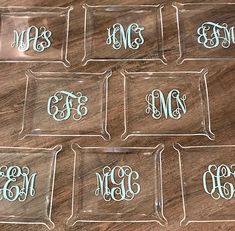 six clear acrylic trays with monogrammed letters