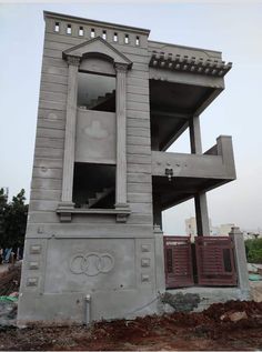 the building is made out of concrete and has an open window