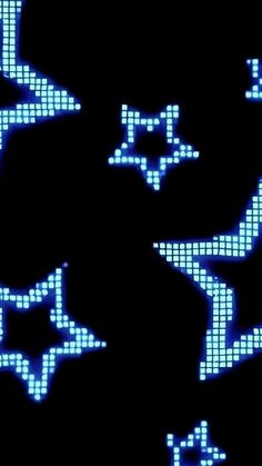 an image of blue and white stars on a black background that looks like pixel art