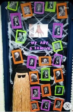 a door decorated with halloween decorations and pictures