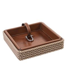 a brown leather tray with handles and rope on the sides, set against a white background