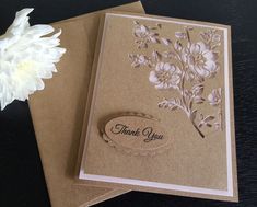 two thank you cards with white flowers on them and a card saying, thank you