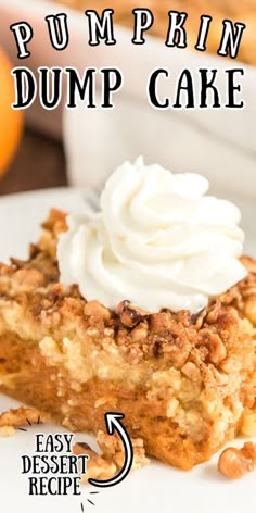 a close up of a slice of pumpkin dump cake on a plate with whipped cream