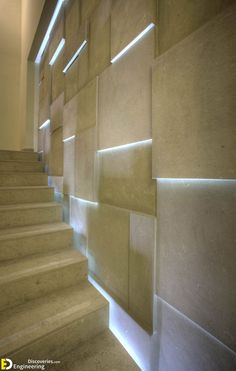 the stairs are lined up against the wall with light coming in from behind them,