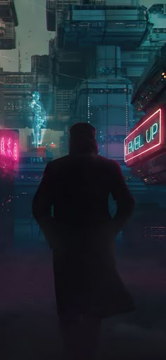 a man standing in the middle of a city at night with neon signs behind him