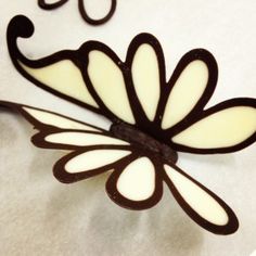 a close up of a clock with a flower on it