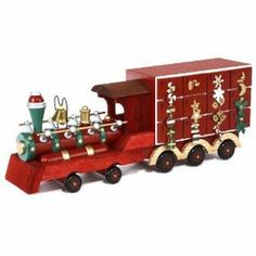 a wooden toy train with christmas decorations on it's side and bells hanging from the front