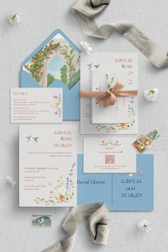 the wedding stationery is laid out on top of each other