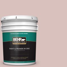 a bucket of behr paint on a blue background