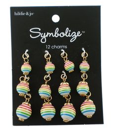 Personalize a DIY jewelry or craft project using these hildie & jo Symbolize Round Gold Charms - Rainbow Stripes Each charm has the same rainbow stripe pattern on a white background There is a gold dotted endcap on each end of the bead The charms have jump rings for easy attachment Add these to bracelets, necklaces, keychains and more Brand: hildie & joCollection: SymbolizeTheme: StripesIncludes 12 charms with jump rings Jewelry Charms Pendants, Bee Pendant, Gold Charms, Jewelry Charms, Jewelry Kits, Gold Dots, Jewelry Making Charms, Silver Lockets, Ball Pendant