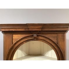 an ornate wooden mantle with arched doorways