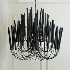 a black chandelier hanging from the ceiling