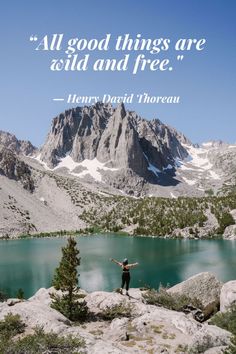 a man standing on top of a mountain next to a lake with a quote about all good things are held and free