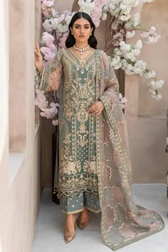 Imrozia Premium Embroidered Organza - I-155 Alpine Make a statement with this designer dress from Pakistan, crafted from premium embroidered organza. The front features intricate handmade embellishments, while the back includes a dyed plain organza with an embroidered motif. Sleeves are adorned with embroidered jaal and motifs, complemented by an organza dupatta with applique work. Raw silk trousers complete the ensemble. Embroidered organza front with handmade embellishments Dyed plain organza Pakistani Kameez, Orang India, Pakistani Formal Dresses, Eid Outfits, Salwar Dress, Dress Salwar Kameez, Gaun Fashion, Pakistani Wedding Outfits, Pakistani Fancy Dresses